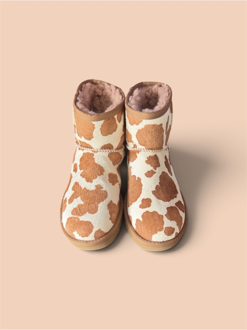 UGG Cow-Print Sheepskin Footies in Brown and White